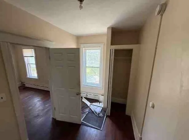 a kitchen with a stove a refrigerator and a stove top oven