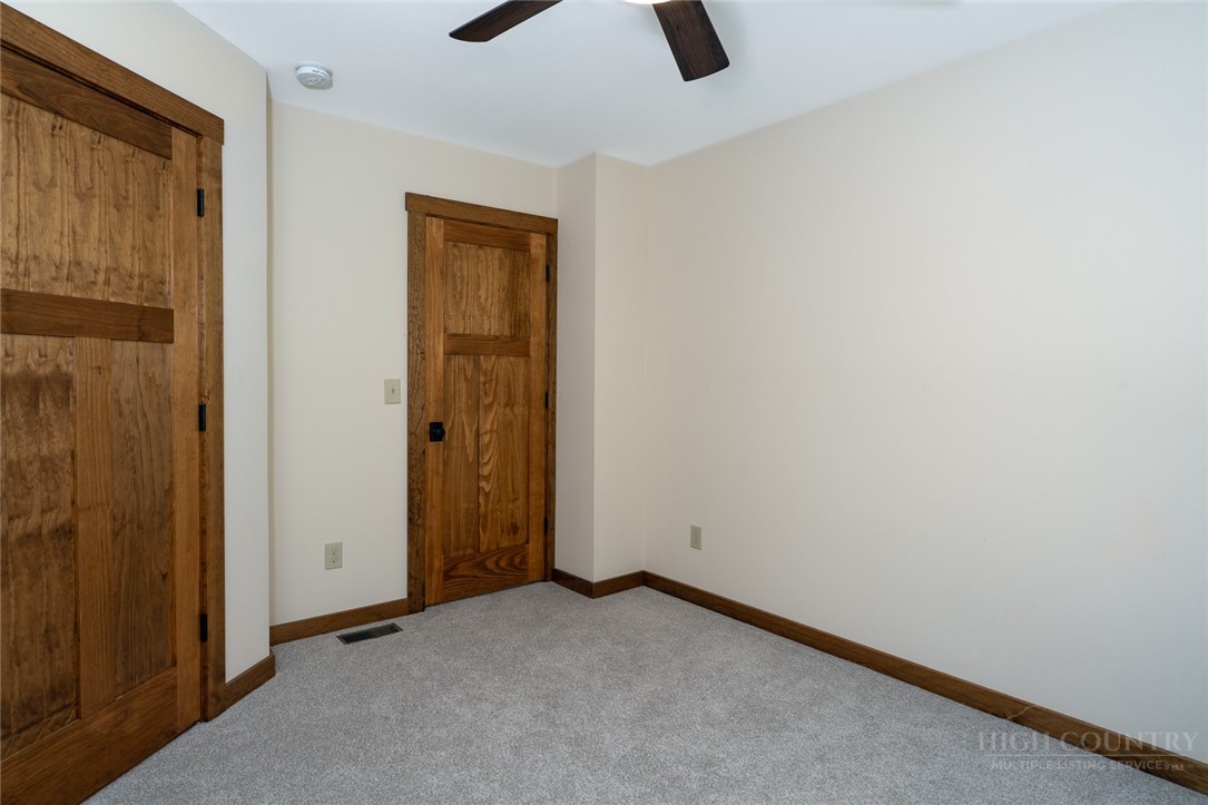 1161 Grandview Dr Extension Boone, NC 28607 - Photo 32 of 43 an empty room with closet and chandelier