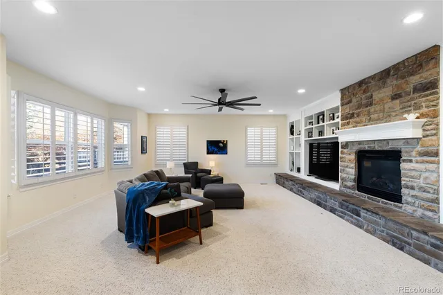 a living room with furniture and a fireplace