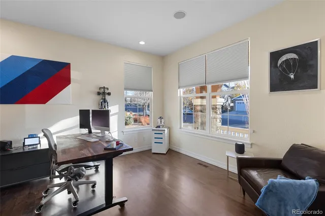 a workspace with furniture and window