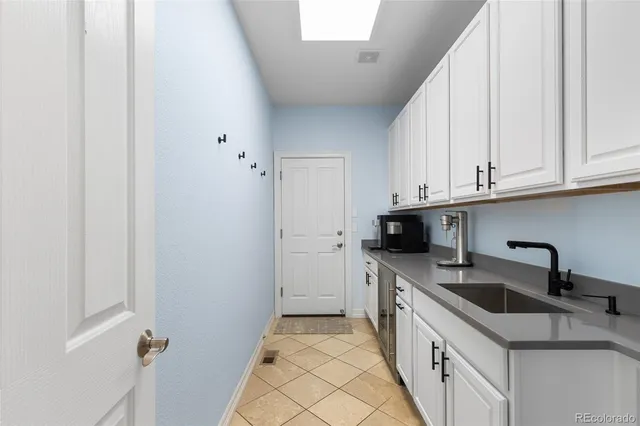 a kitchen with a sink and cabinets