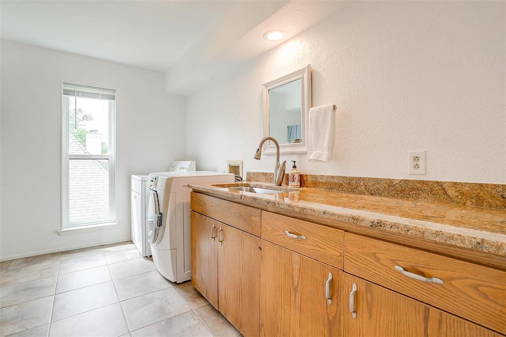 4100 Inwood Road Fort Worth, TX 76109 - Photo 26 of 40 a bathroom with a sink and a mirror