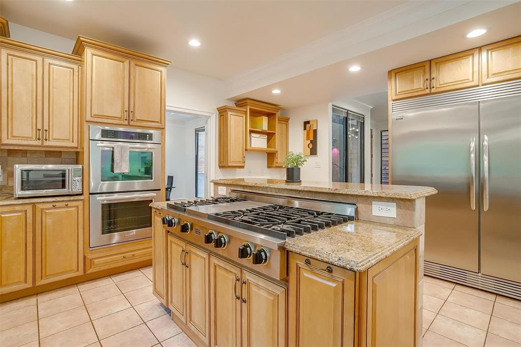 4100 Inwood Road Fort Worth, TX 76109 - Photo 4 of 40 a kitchen with stainless steel appliances granite countertop a stove a sink and a refrigerator