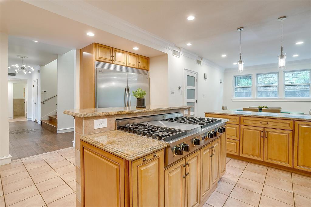 4100 Inwood Road Fort Worth, TX 76109 - Photo 5 of 40 a kitchen with stainless steel appliances granite countertop a stove a sink and a refrigerator