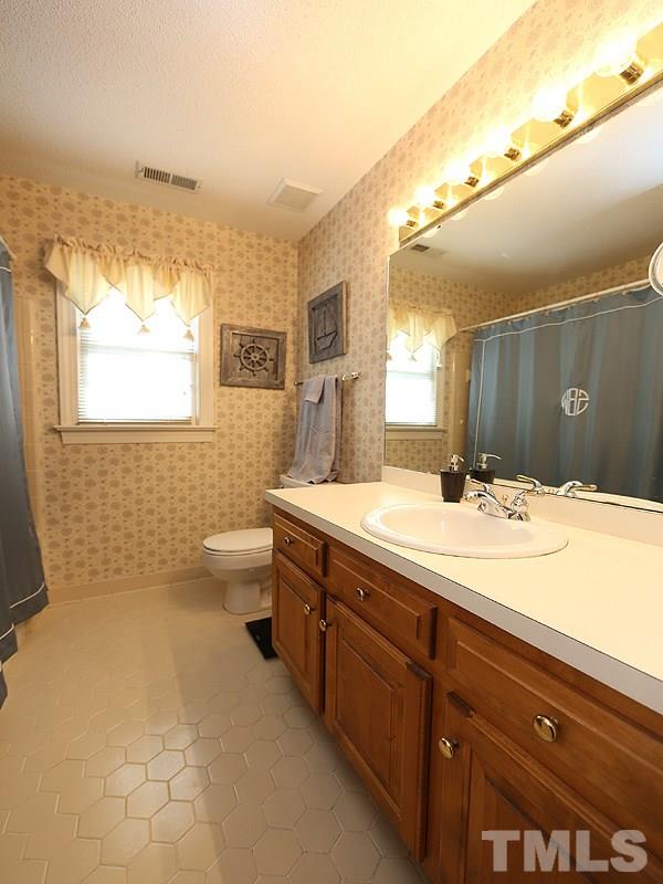 2009 Hamrick Drive Raleigh, NC 27615 - Photo 17 of 25 Ceramic Tile Floor, Shower Combo, Single Sink