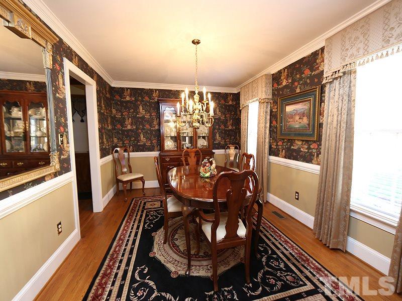 2009 Hamrick Drive Raleigh, NC 27615 - Photo 5 of 25 Hardwoods, Wainscoting, Crown Moldings and lots of natural lighting