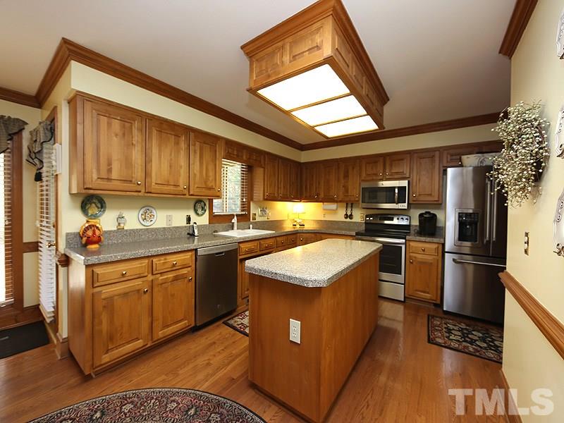 2009 Hamrick Drive Raleigh, NC 27615 - Photo 10 of 25 A Pantry & an Island make this a work friendly Kitchen
