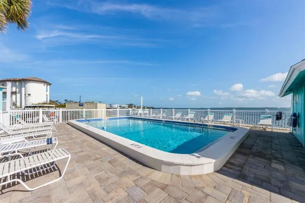 a view of a swimming pool with a patio