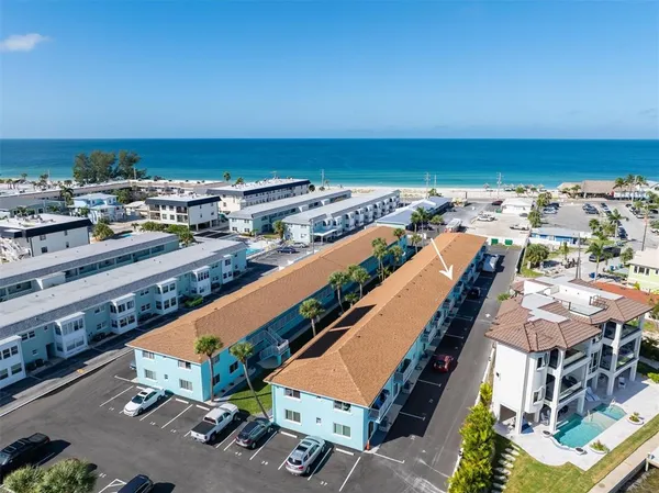 an aerial view of residential building and ocean