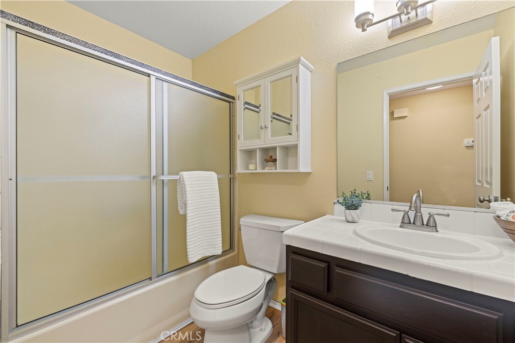 33533 Santiago Road Acton, CA 93510 - Photo 14 of 36 a bathroom with a sink toilet and shower