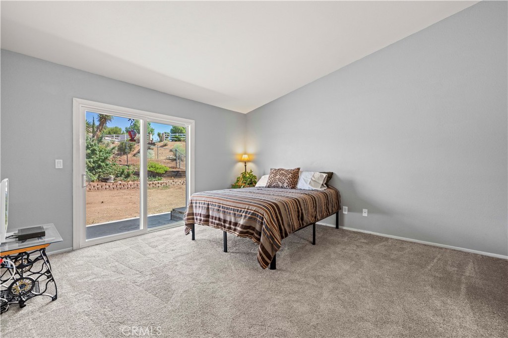 33533 Santiago Road Acton, CA 93510 - Photo 18 of 36 a bedroom with a bed and a window