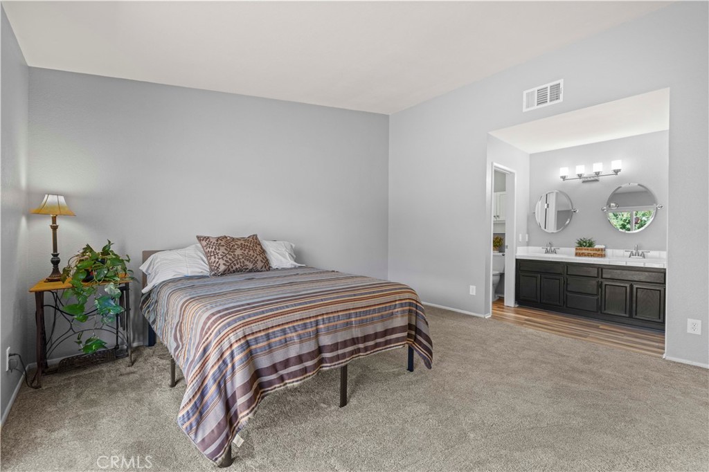 33533 Santiago Road Acton, CA 93510 - Photo 19 of 36 a bedroom with a bed and a dresser