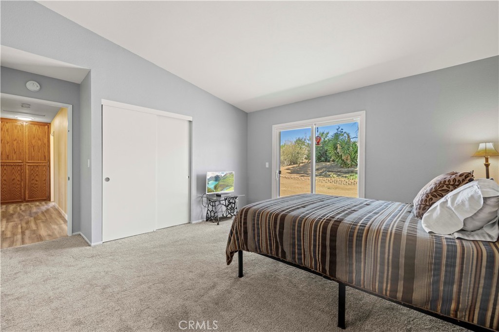 33533 Santiago Road Acton, CA 93510 - Photo 20 of 36 a bed sitting in a bedroom next to a window