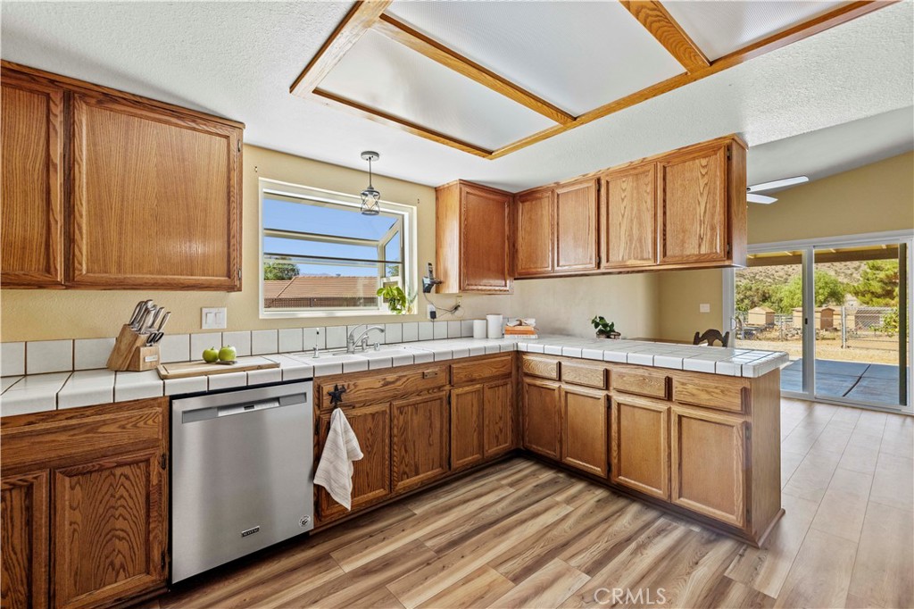 33533 Santiago Road Acton, CA 93510 - Photo 8 of 36 a kitchen with stainless steel appliances granite countertop a sink stove and cabinets
