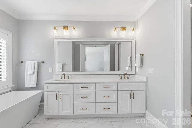 a bathroom with a shower a mirror and a shower