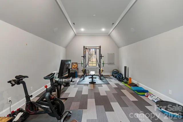 a kitchen with a sink cabinets and wooden floor