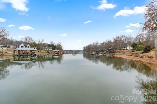 a view of swimming pool in front of house