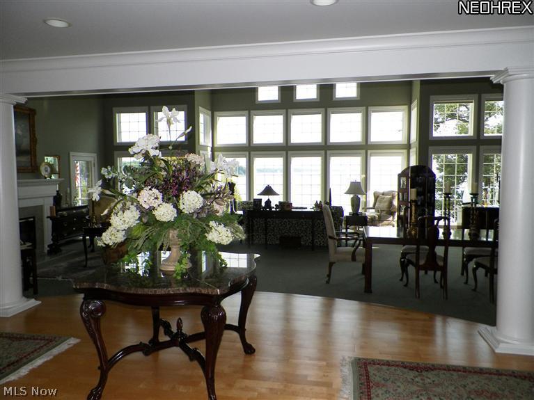 2730 North Bluff Ridge Drive Port Clinton, OH 43452 - Photo 4 of 25 The foyer leads into the impressive Living and Dining Room with floor to ceiling windows and views of the Lake beyond.