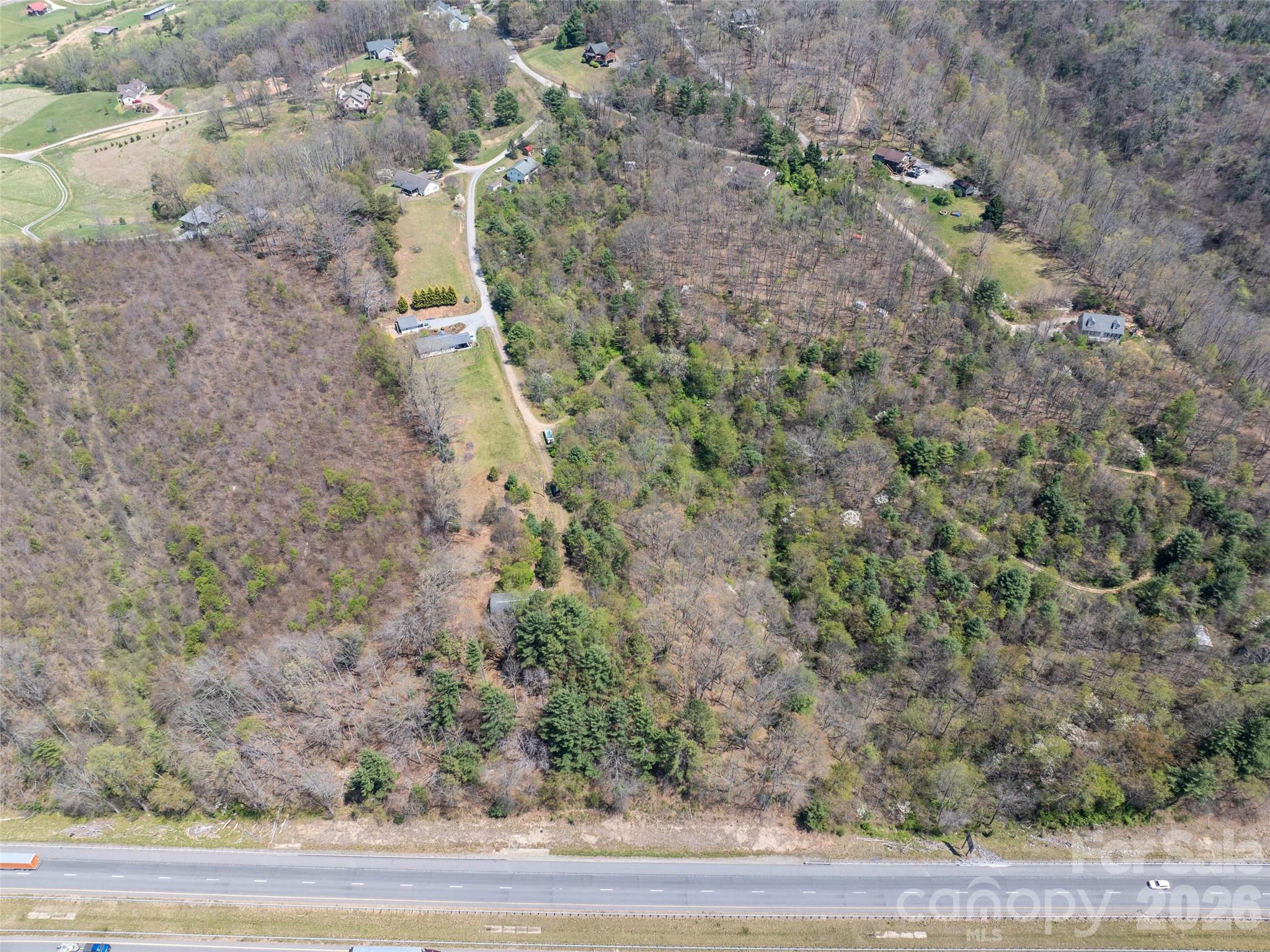 Lot 43 Sunnybrook Trail Clyde, NC 28721 - Photo 6 of 11 a aerial view of a house with a yard