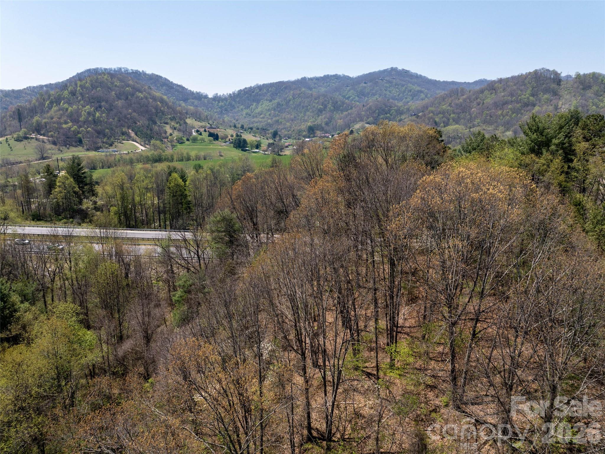 Lot 43 Sunnybrook Trail Clyde, NC 28721 - Photo 7 of 11 a view of a lush green hillside and houses