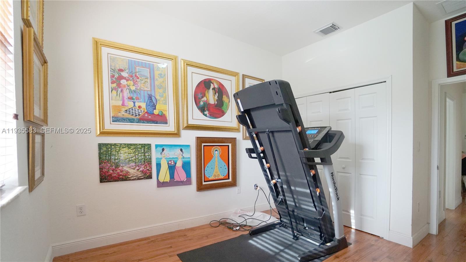 928 Southwest 154th Path, Unit 928 Miami, FL 33194 - Photo 21 of 39 a view of an entryway with wooden floor