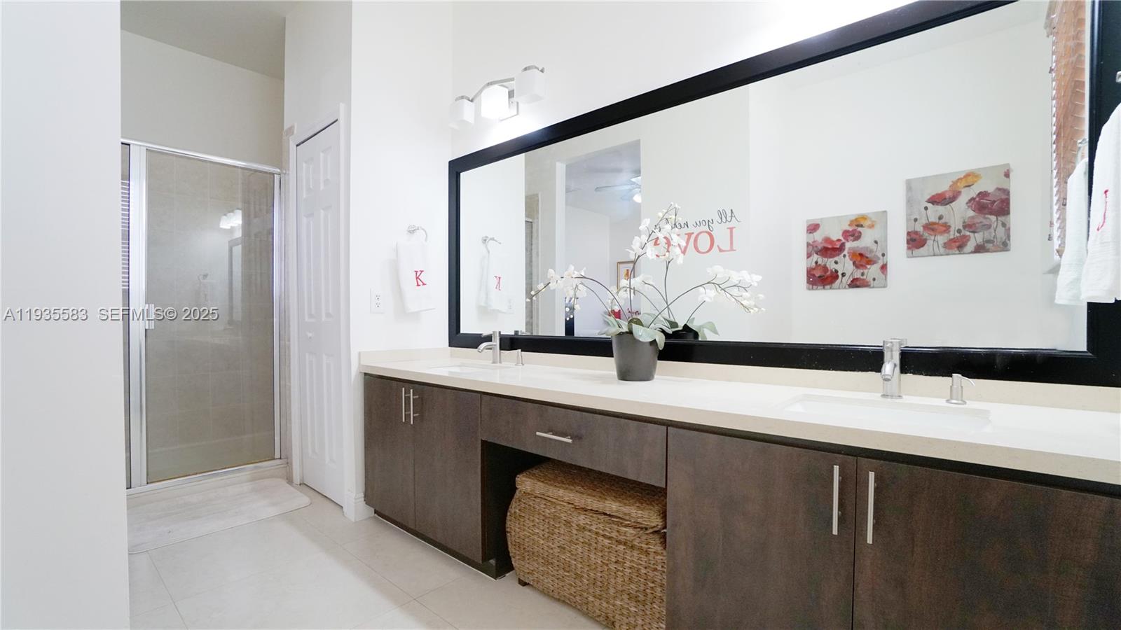 928 Southwest 154th Path, Unit 928 Miami, FL 33194 - Photo 32 of 39 a bathroom with a double vanity sink mirror and double