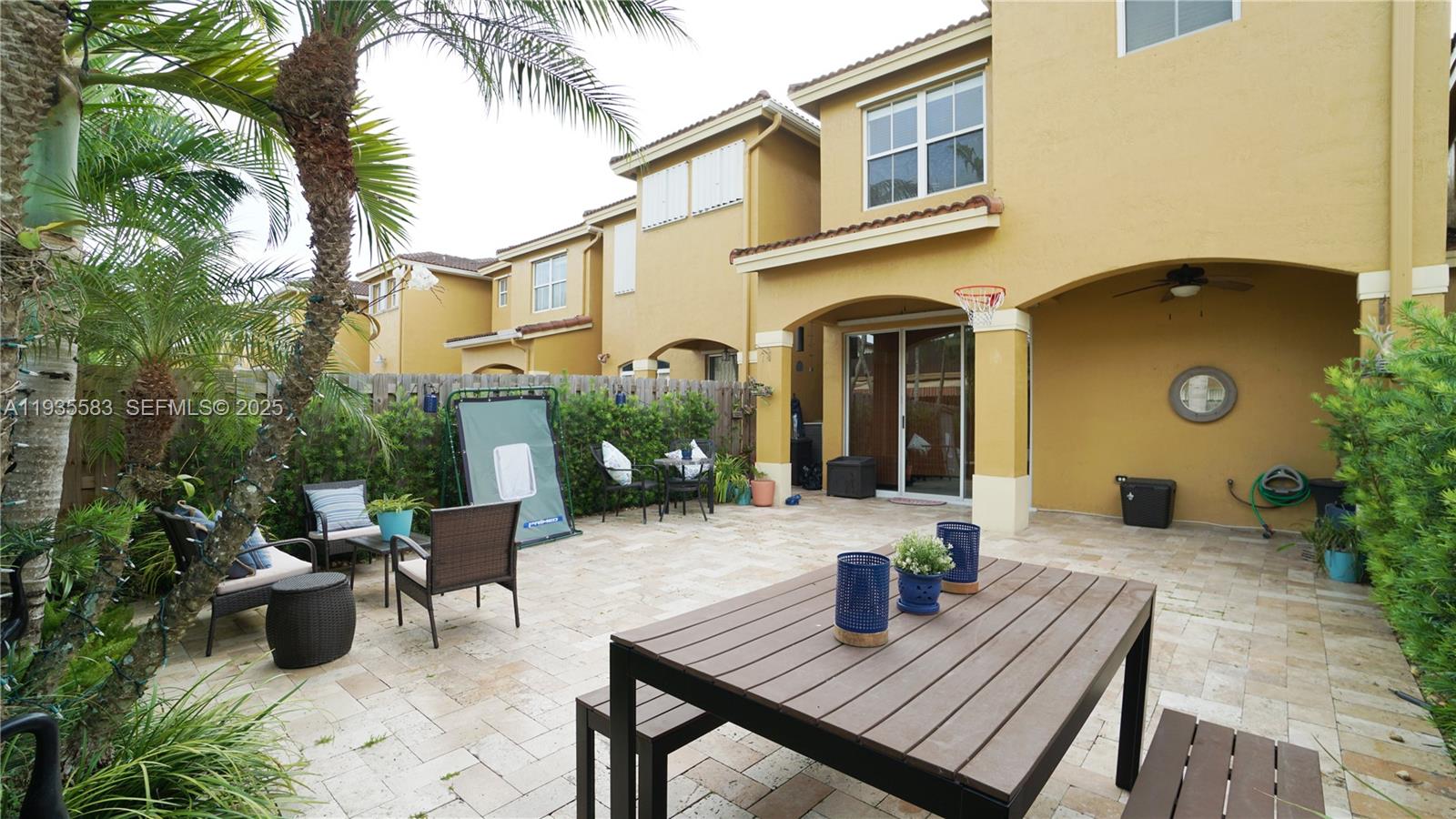 928 Southwest 154th Path, Unit 928 Miami, FL 33194 - Photo 35 of 39 a view of a house with backyard and sitting area