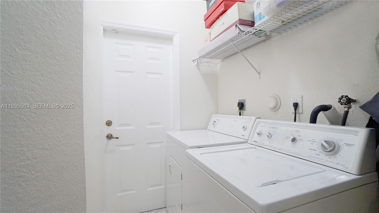 928 Southwest 154th Path, Unit 928 Miami, FL 33194 - Photo 39 of 39 a utility room with dryer and washer
