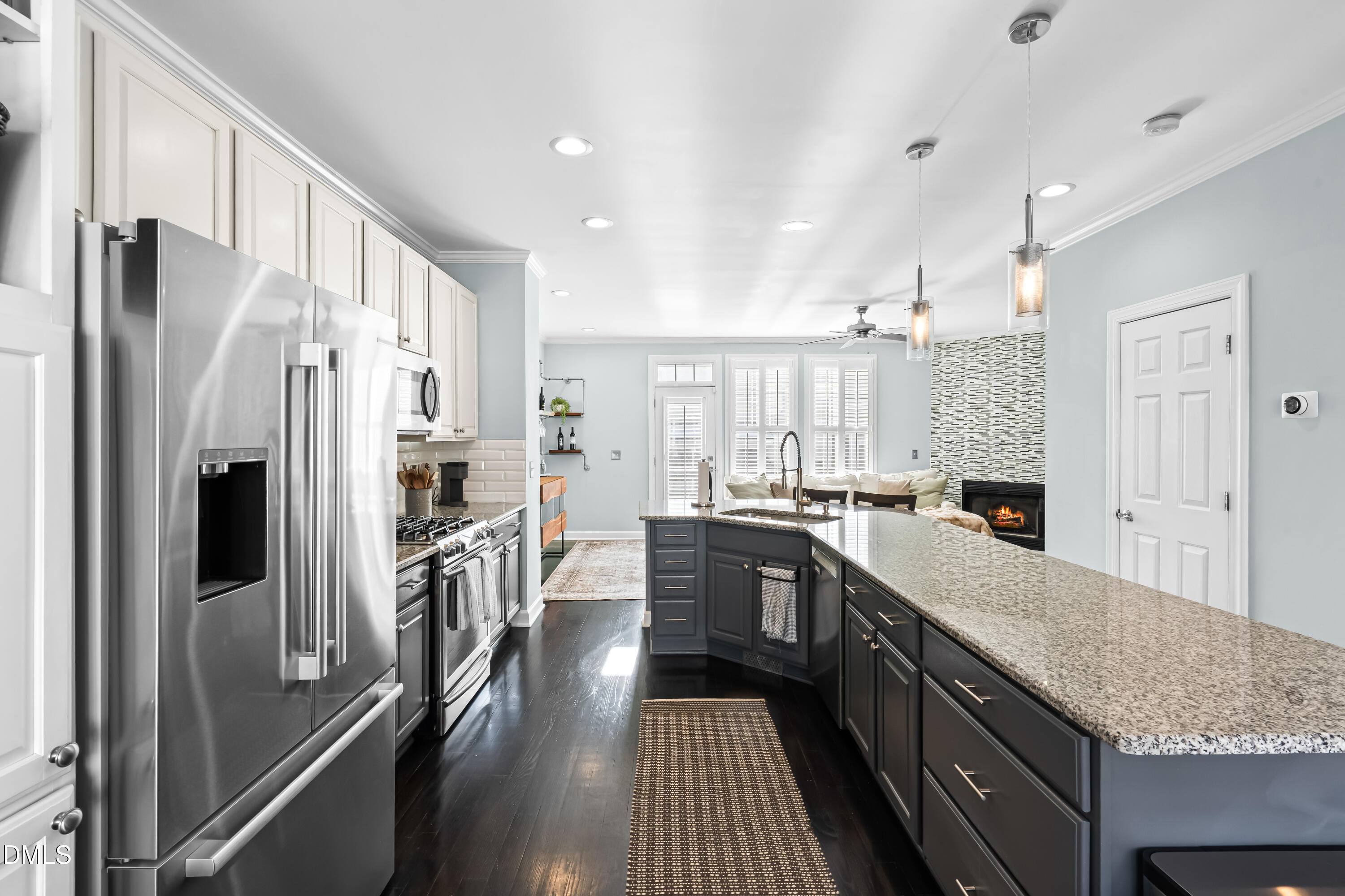 6104 Shandwick Court Raleigh, NC 27609 - Photo 9 of 40 a large kitchen with stainless steel appliances granite countertop a refrigerator a stove and a sink