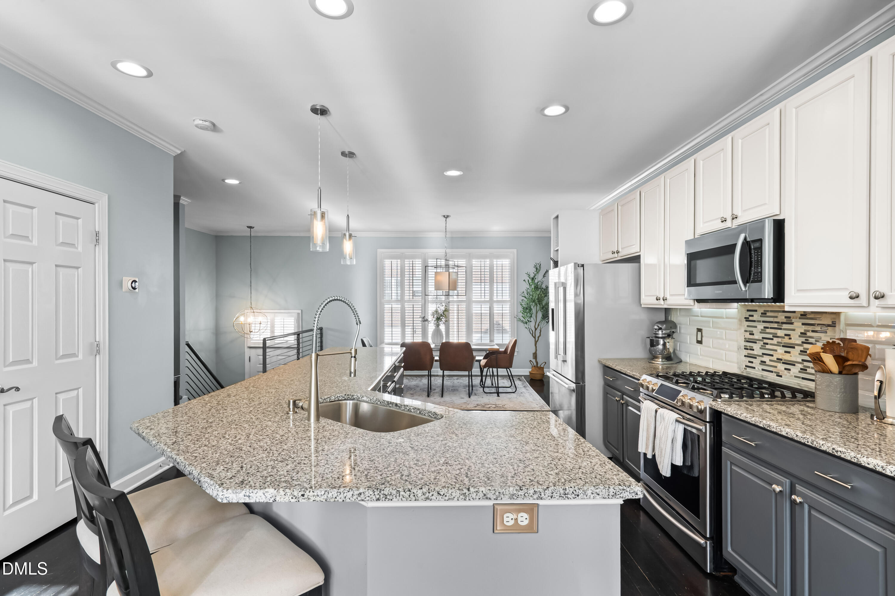 6104 Shandwick Court Raleigh, NC 27609 - Photo 11 of 40 a kitchen with stainless steel appliances granite countertop a sink dishwasher a refrigerator and a microwave