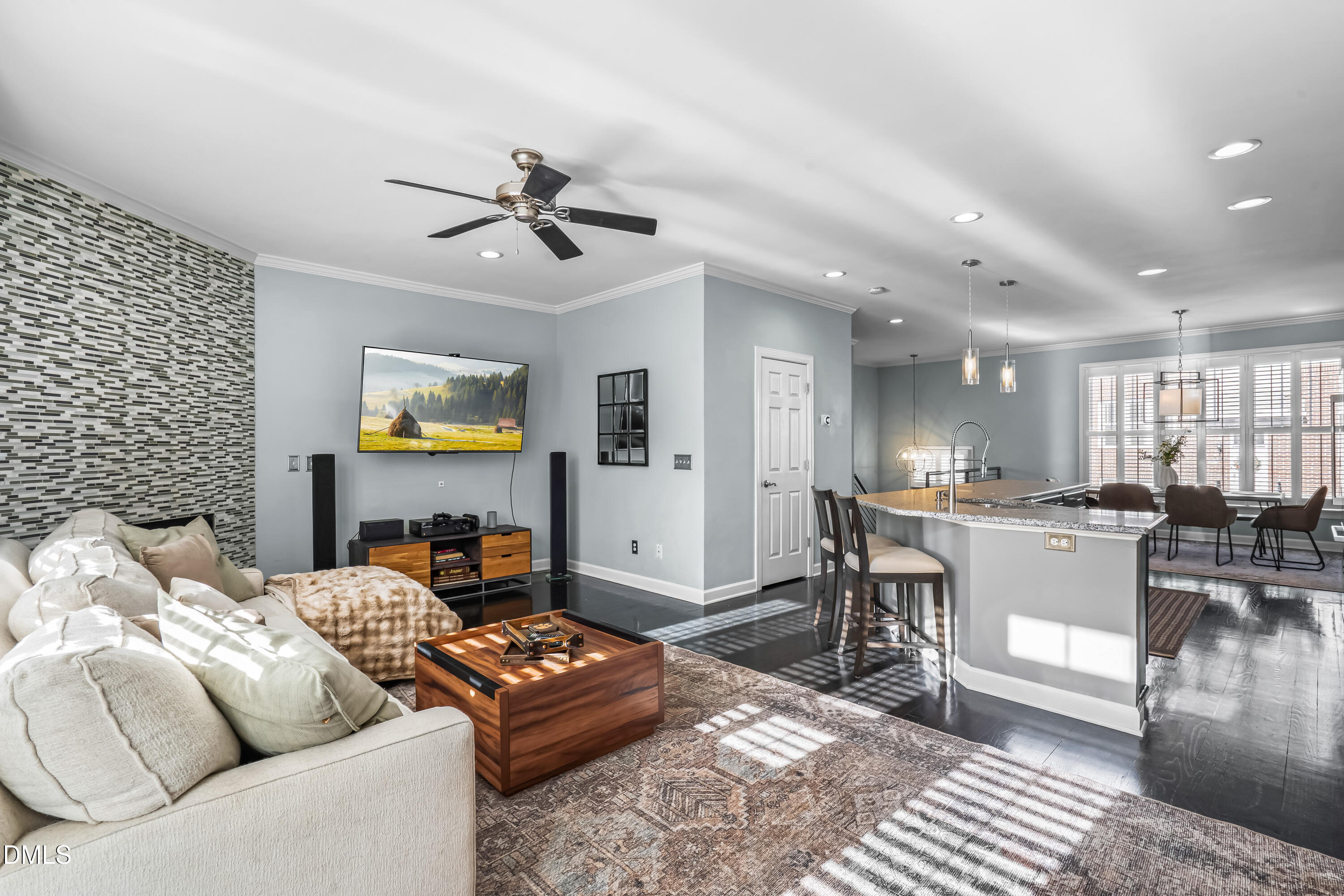 6104 Shandwick Court Raleigh, NC 27609 - Photo 14 of 40 a living room with furniture and a flat screen tv