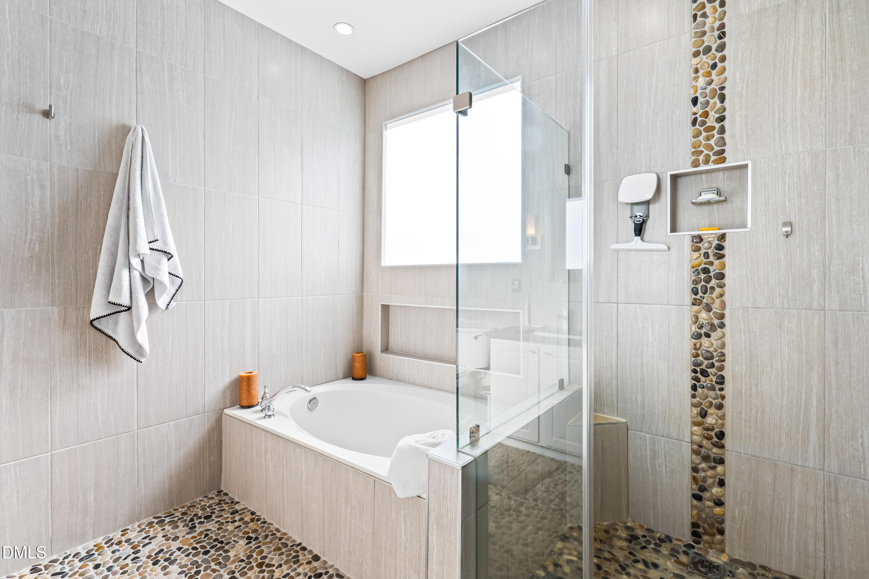 6104 Shandwick Court Raleigh, NC 27609 - Photo 21 of 40 a bathroom with a bathtub and shower