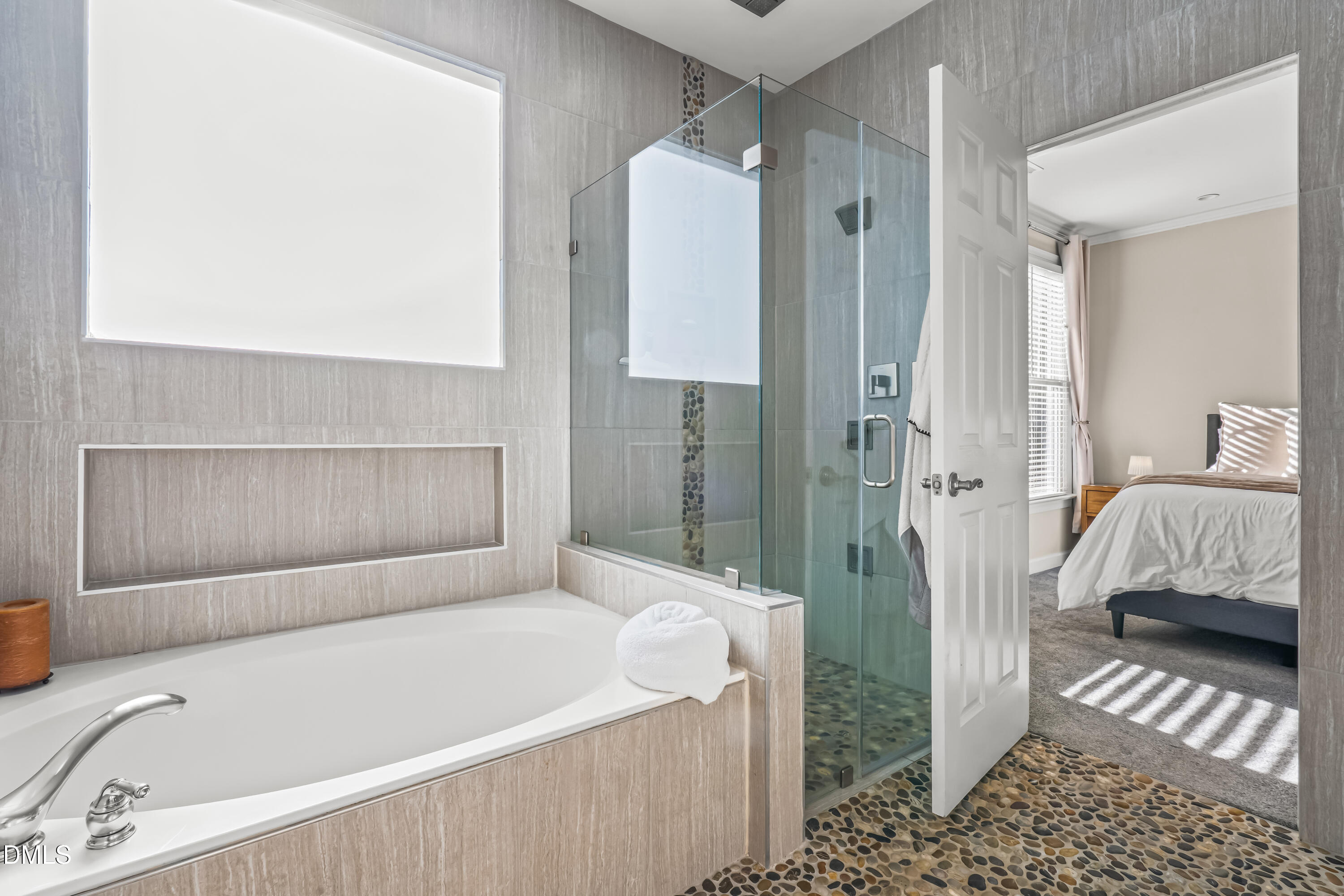 6104 Shandwick Court Raleigh, NC 27609 - Photo 22 of 40 a bathroom with a bathtub and a shower