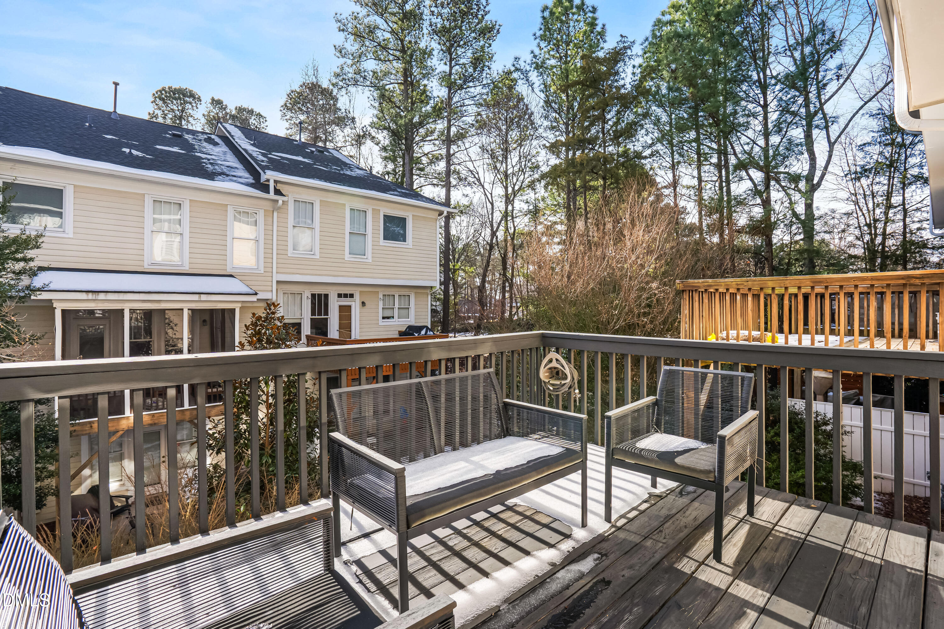 6104 Shandwick Court Raleigh, NC 27609 - Photo 23 of 40 a view of a chair and table on the deck