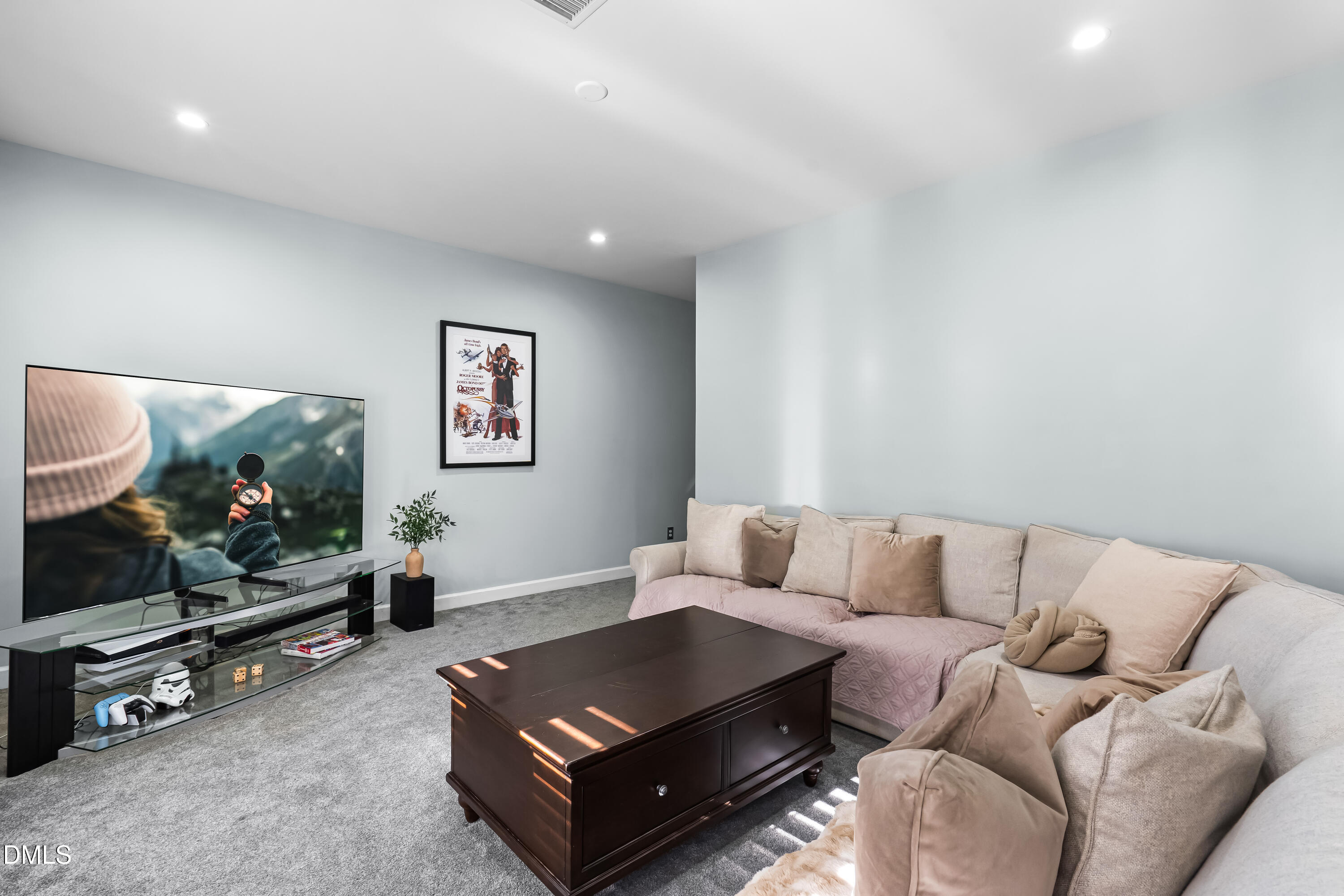 6104 Shandwick Court Raleigh, NC 27609 - Photo 26 of 40 a living room with furniture and a flat screen tv