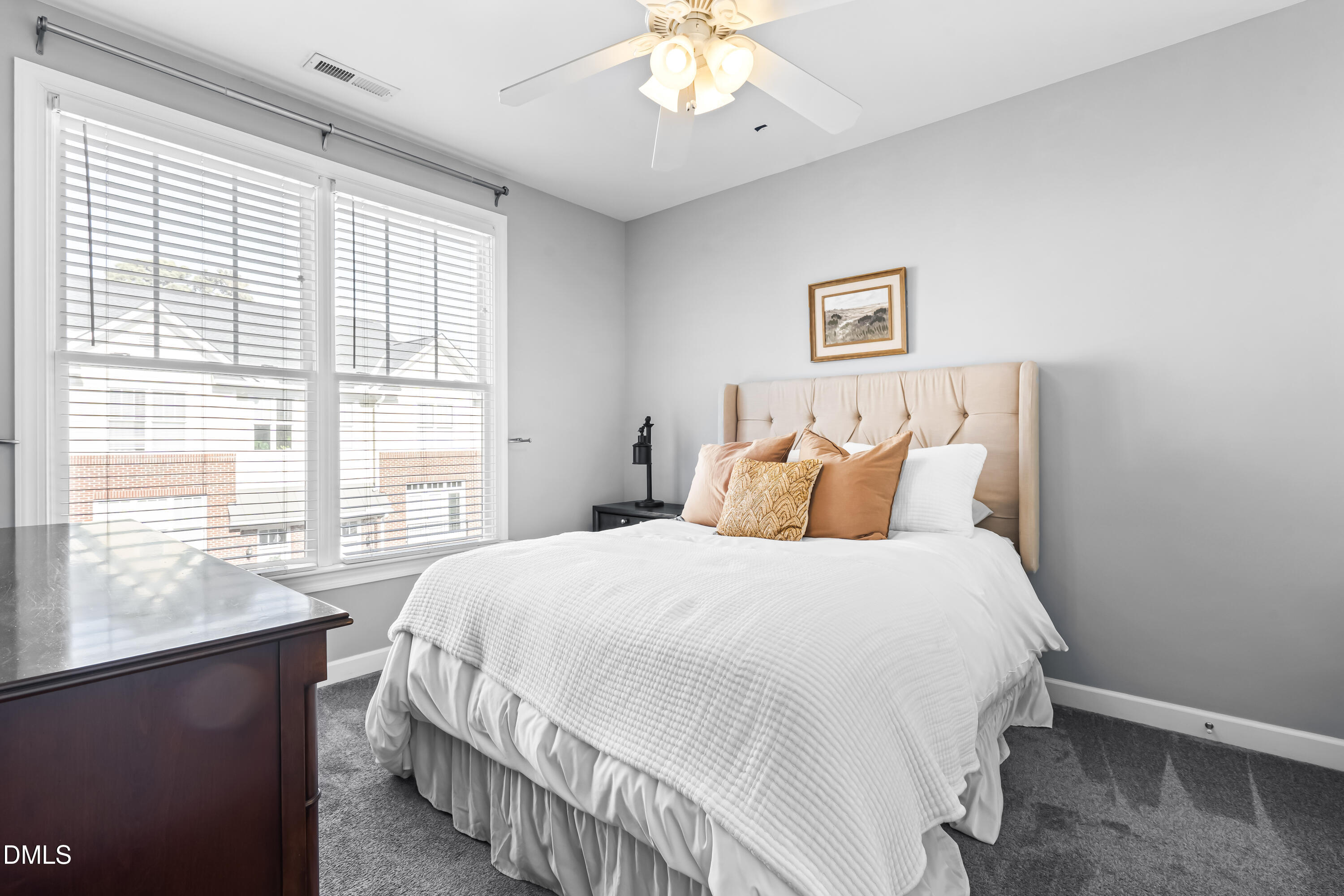 6104 Shandwick Court Raleigh, NC 27609 - Photo 29 of 40 a bedroom with a large bed and a window