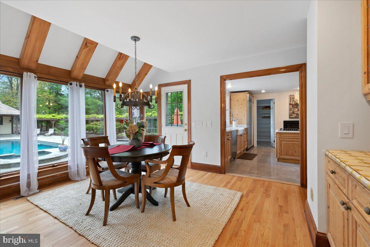 19 Rolling Hill Road Skillman, NJ 08558 - Photo 11 of 69 a view of a dining room with furniture window and wooden floor