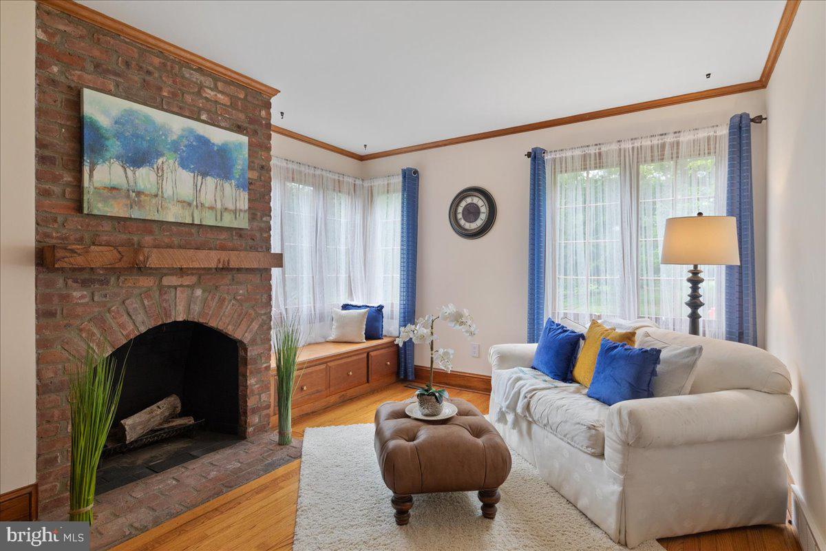 19 Rolling Hill Road Skillman, NJ 08558 - Photo 18 of 69 a living room with furniture and a fireplace