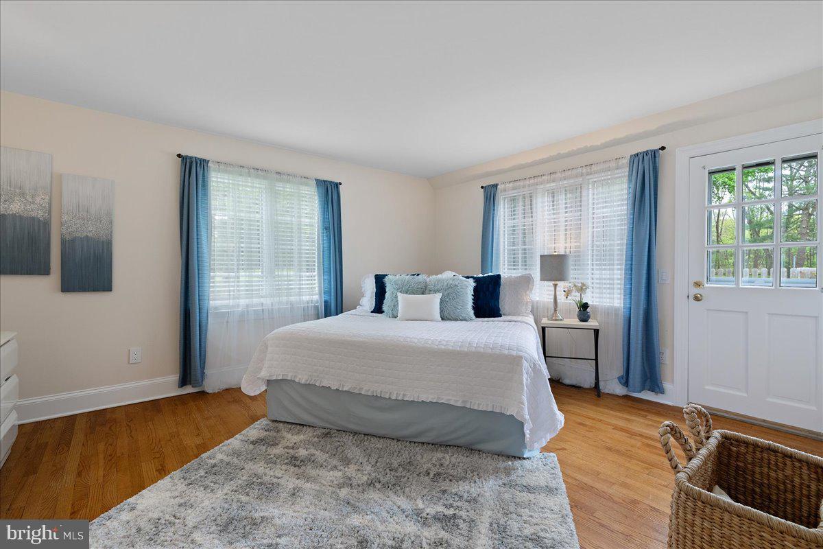 19 Rolling Hill Road Skillman, NJ 08558 - Photo 20 of 69 a bedroom with a bed and wooden floor