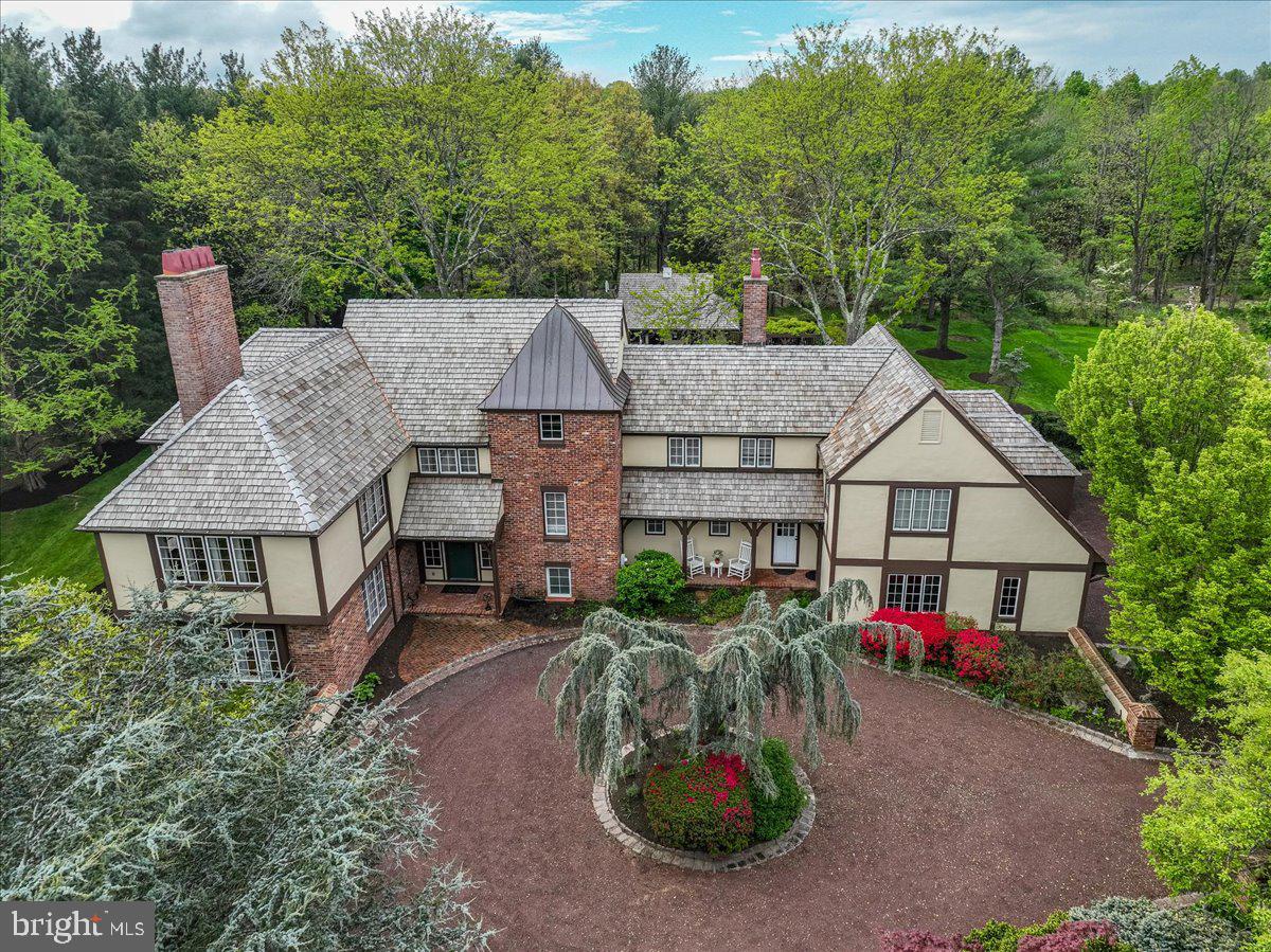 19 Rolling Hill Road Skillman, NJ 08558 - Photo 3 of 69 an aerial view of a house with swimming pool and garden
