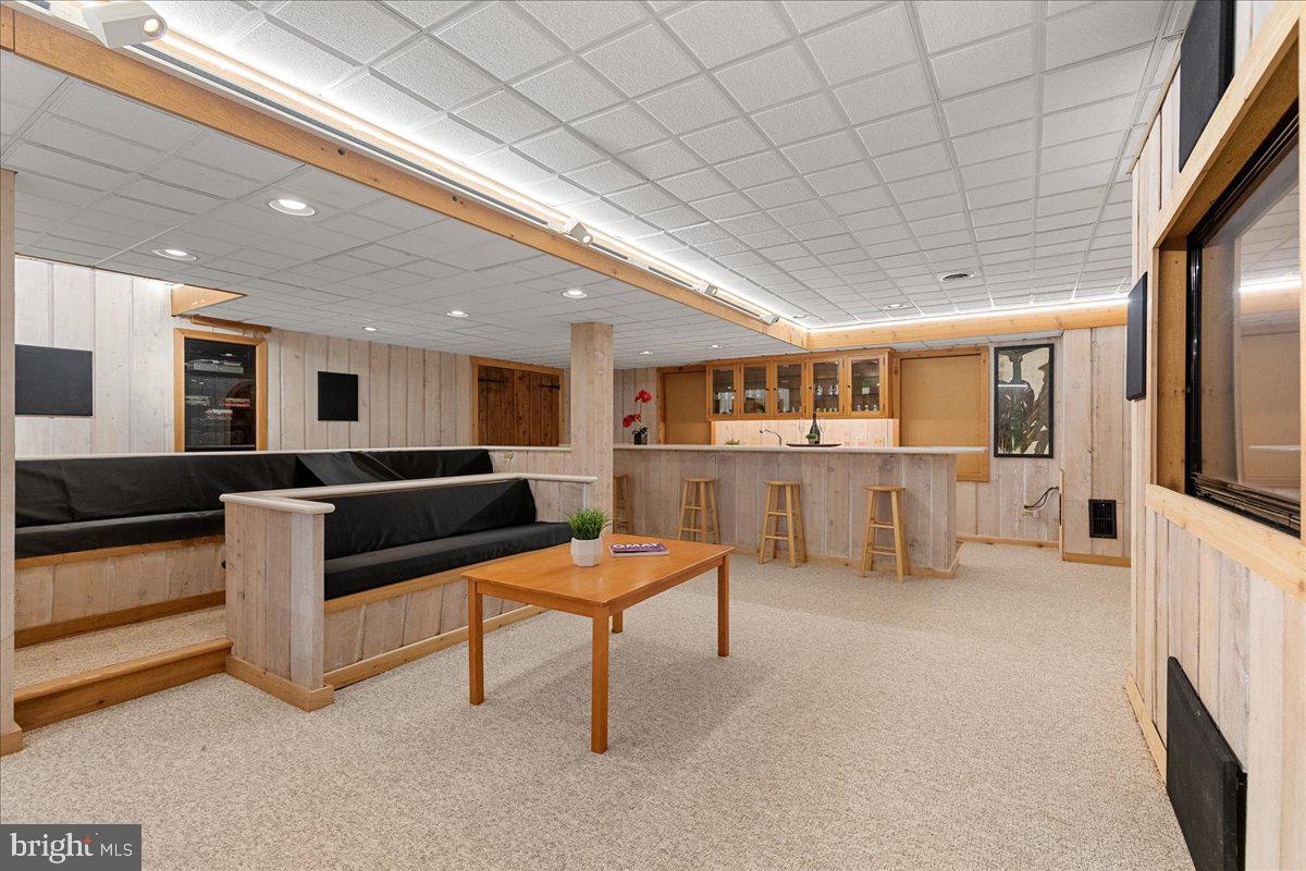 19 Rolling Hill Road Skillman, NJ 08558 - Photo 37 of 69 a living room with furniture and a flat screen tv