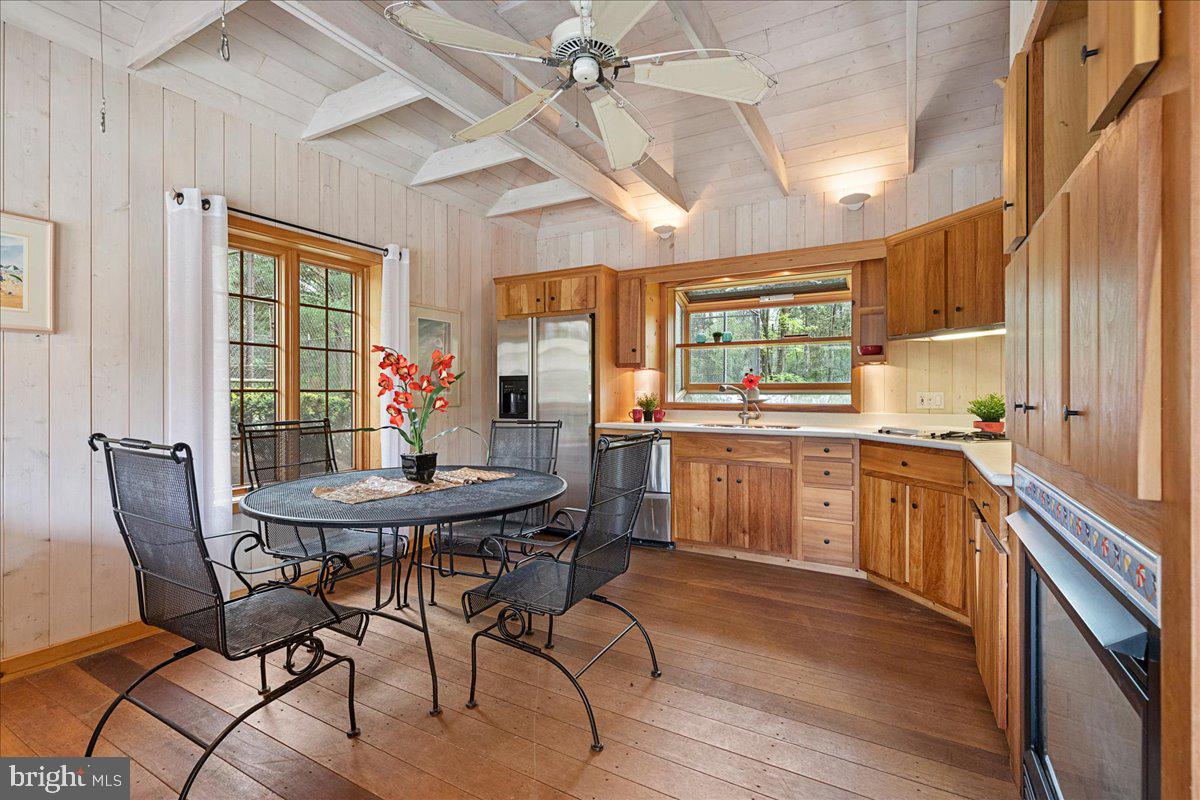 19 Rolling Hill Road Skillman, NJ 08558 - Photo 48 of 69 a kitchen with a table chairs refrigerator and window