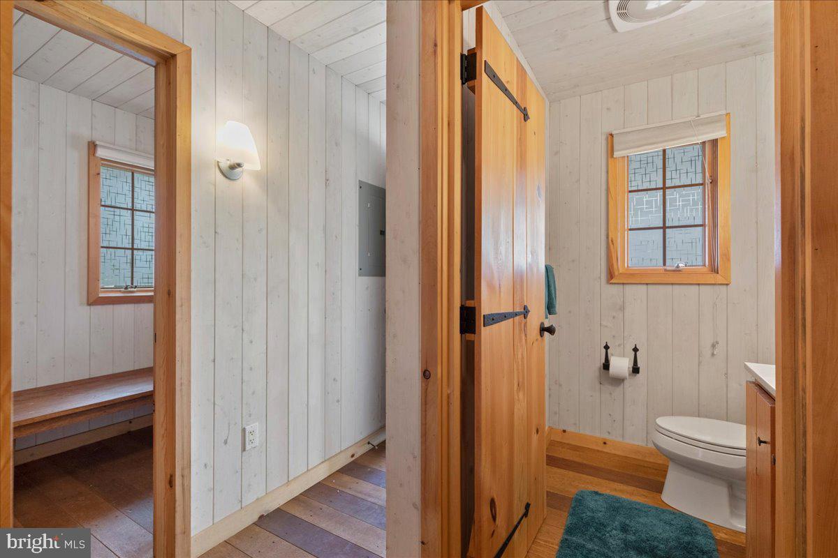 19 Rolling Hill Road Skillman, NJ 08558 - Photo 51 of 69 a bathroom with a granite countertop toilet a sink and a mirror