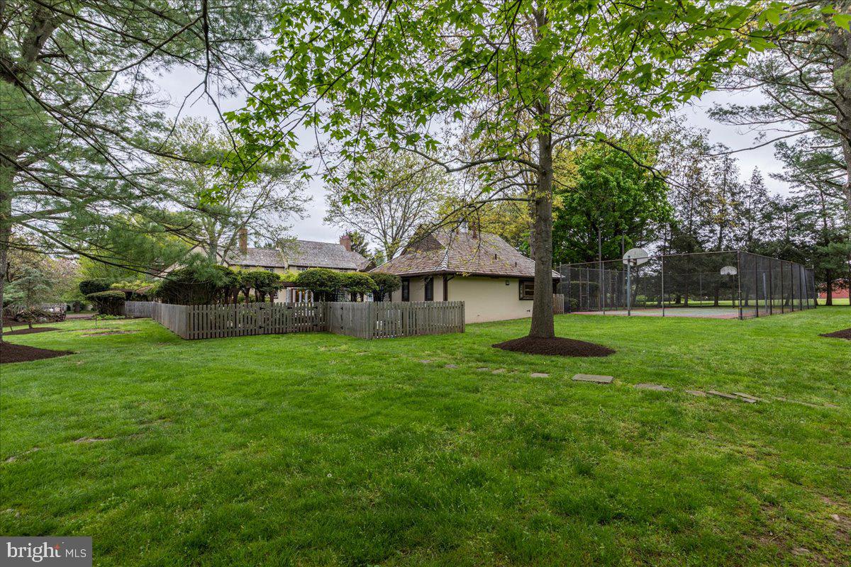 19 Rolling Hill Road Skillman, NJ 08558 - Photo 59 of 69 a view of a house next to a big yard and large trees