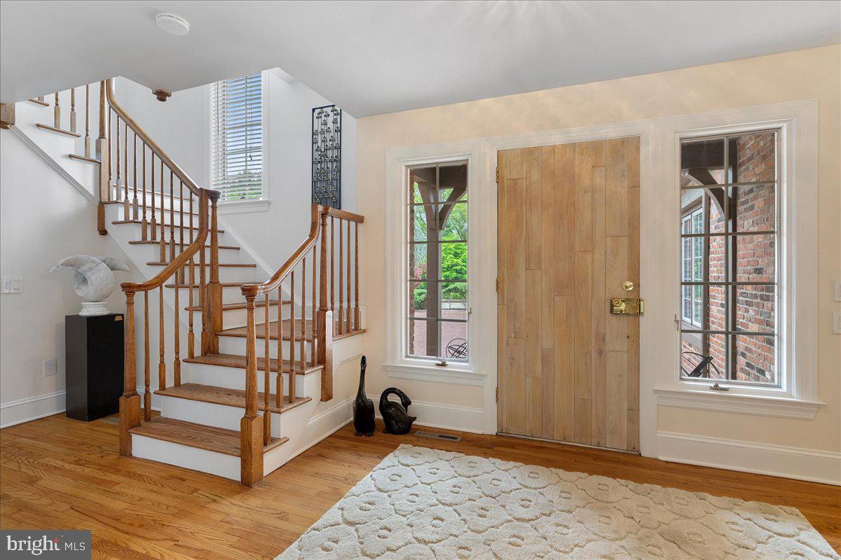 19 Rolling Hill Road Skillman, NJ 08558 - Photo 7 of 69 a view of entryway with wooden floor and stairs
