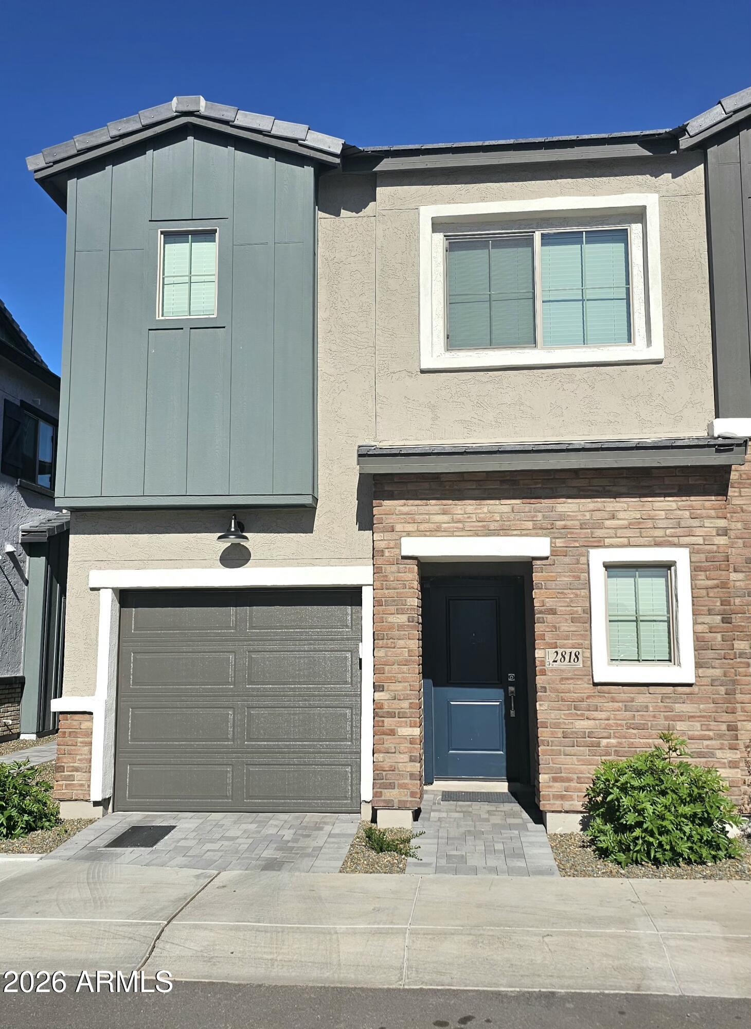 2818 West Red Fox Road Phoenix, AZ 85085 - Photo 1 of 19 a front view of a house
