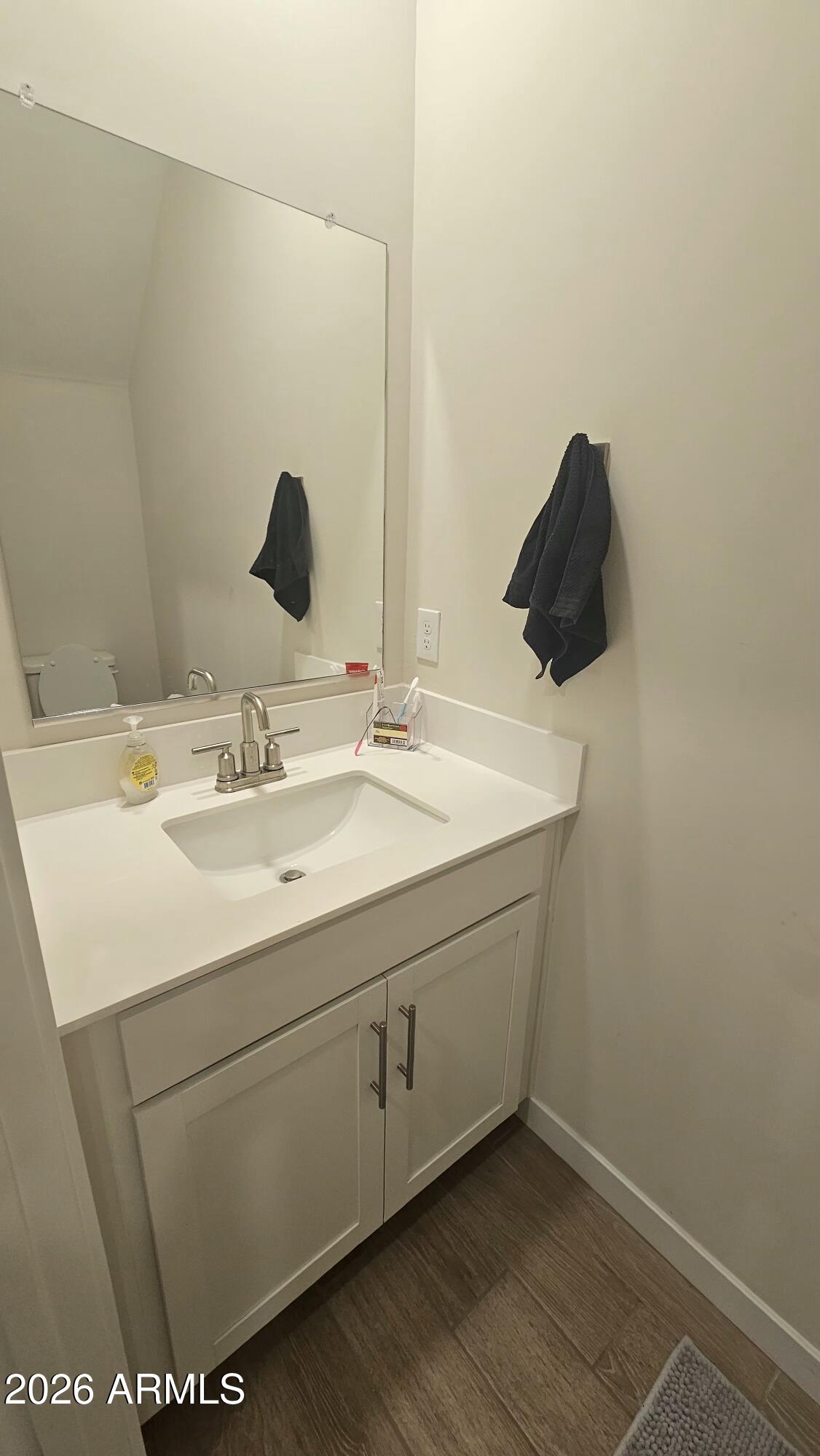2818 West Red Fox Road Phoenix, AZ 85085 - Photo 15 of 19 a bathroom with a sink and a mirror