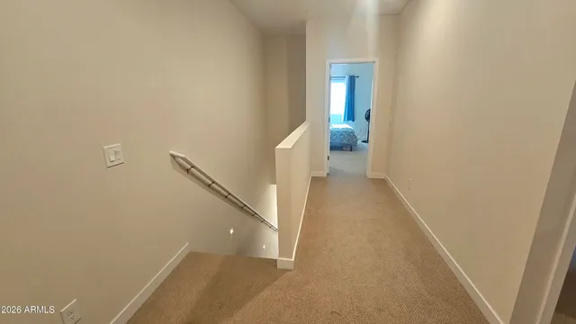 a view of a hallway with white walls