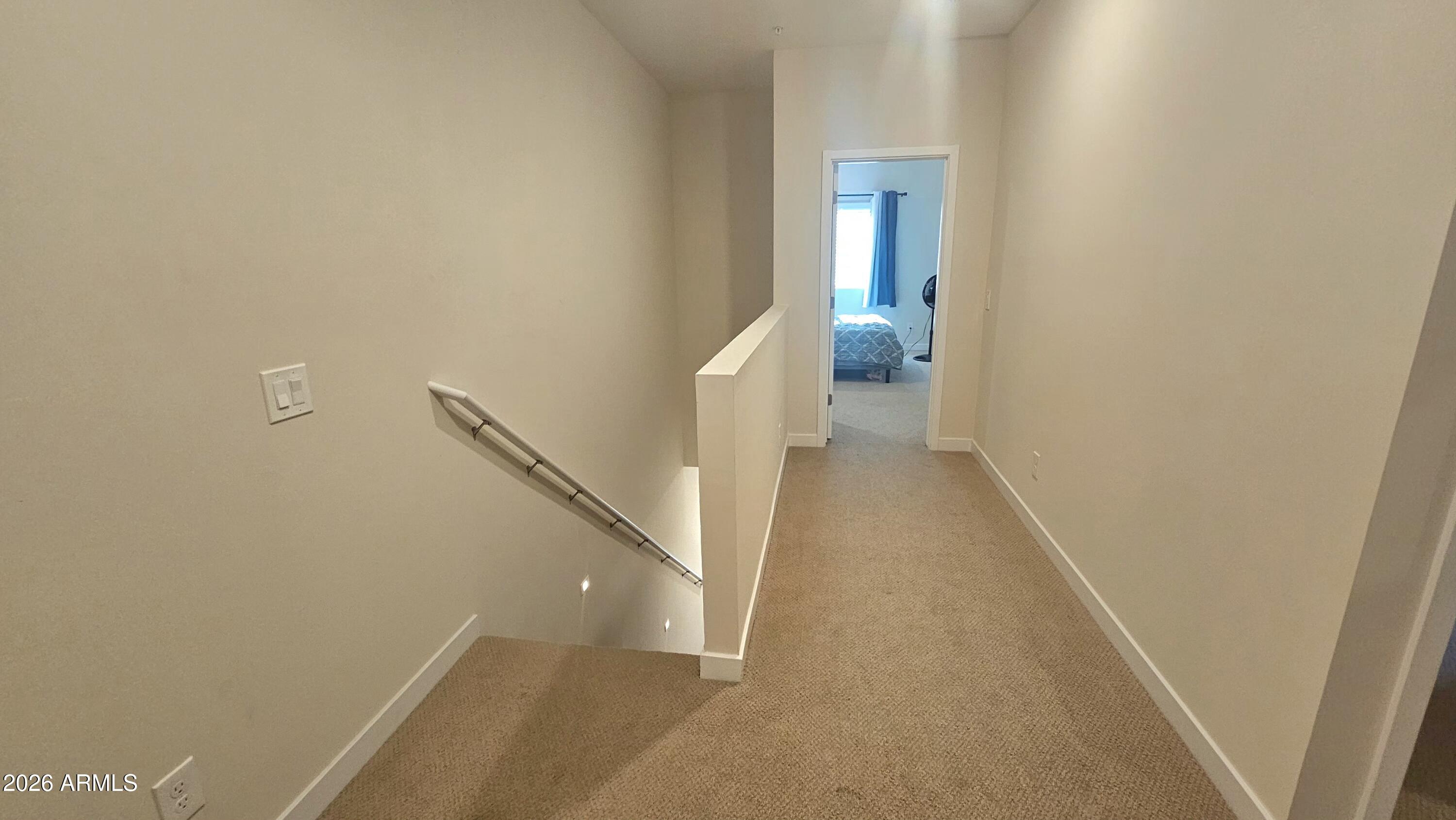 2818 West Red Fox Road Phoenix, AZ 85085 - Photo 5 of 19 a view of a hallway with white walls