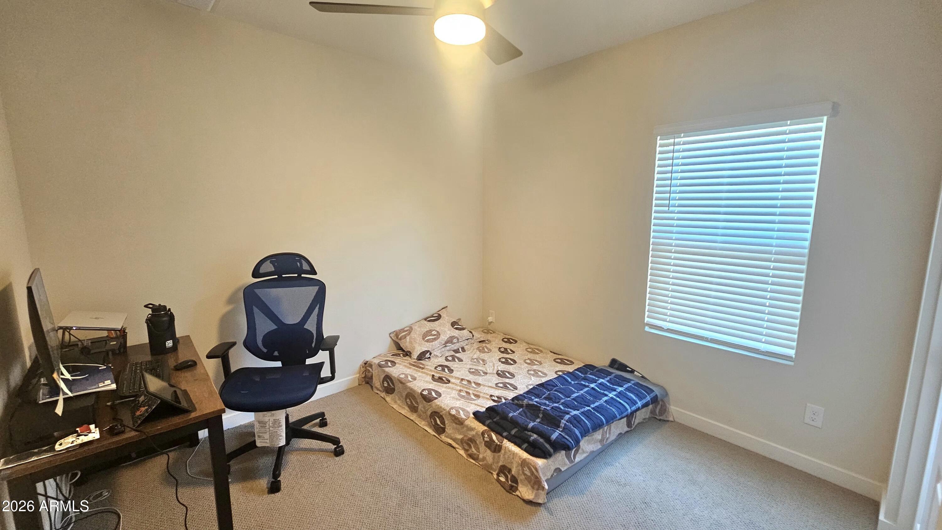 2818 West Red Fox Road Phoenix, AZ 85085 - Photo 9 of 19 a living room with furniture and a window